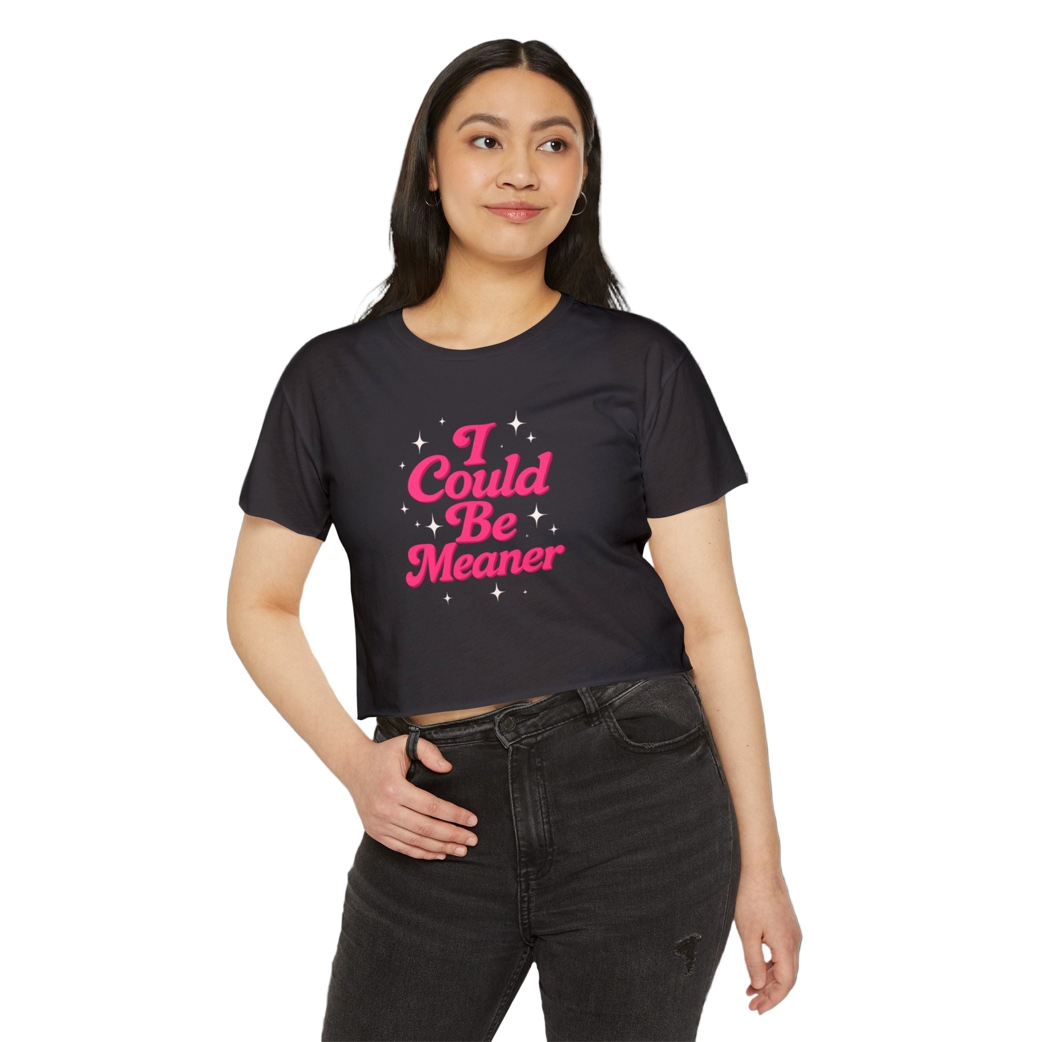 Person wearing a black t-shirt with pink text on a white background