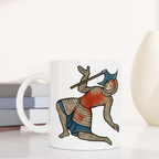 Mug with warrior design on a white surface with books and decorative items.