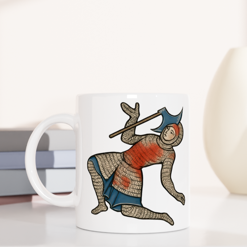 Mug with warrior design on a white surface with books and decorative items.